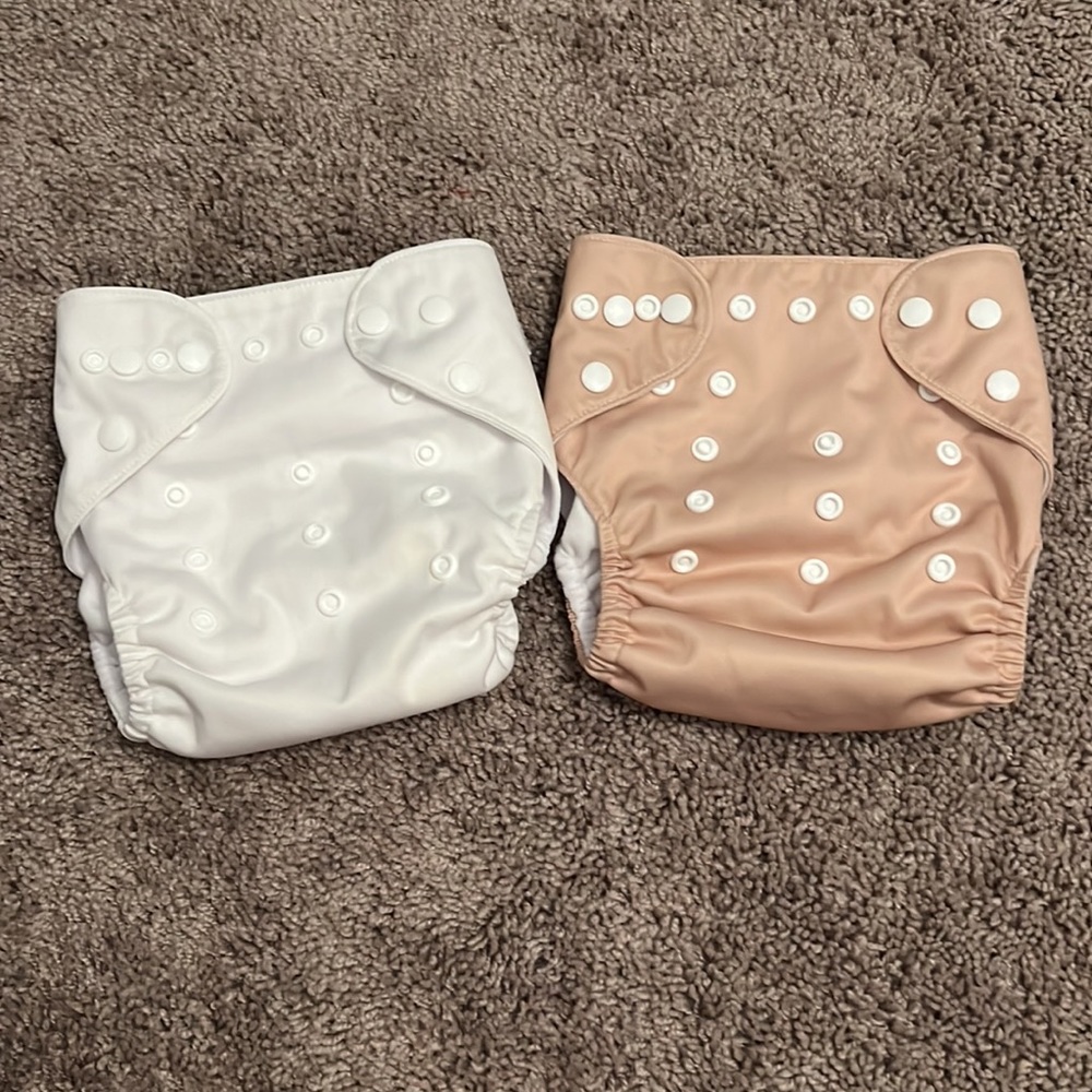 Tan/cream and white reusable cloth diapers + inserts